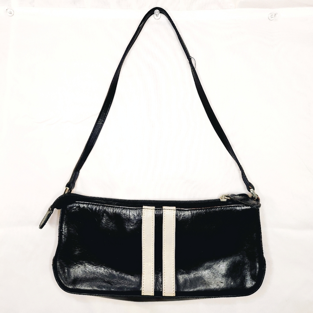 black leather purse with white stripes